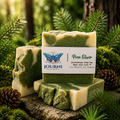 Bottle of Journi Pine Elixir with pine needles and forest background, promoting natural wellness and inner balance.